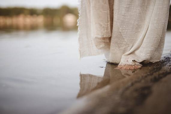 feet walking on the shore